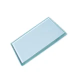 A clear, rectangular dental glass mixing slab with a smooth, flat surface, used for preparing dental cements and materials.